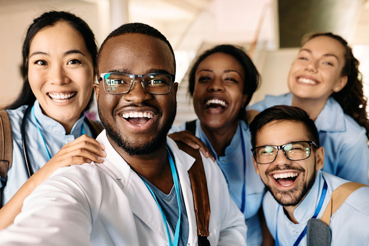 five smiling nurse practitioners